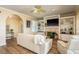 Inviting living room with a cozy fireplace, built-in shelving, and natural light at 1748 Sunset Dr, Clearwater, FL 33755