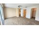 Spacious carpeted bedroom with ceiling fan, bathroom, walk-in closet and sliding door to balcony at 2113 E Del Webb Blvd, Sun City Center, FL 33573