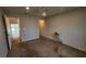 Bedroom with carpet, neutral walls, ceiling fan, and access to a screened patio and ensuite bathroom at 2113 E Del Webb Blvd, Sun City Center, FL 33573