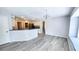Dining area with gray vinyl floors, neutral paint, and white trim at 2113 E Del Webb Blvd, Sun City Center, FL 33573