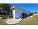 Beautiful home exterior with lush landscaping and well-manicured lawn at 2113 E Del Webb Blvd, Sun City Center, FL 33573