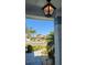 A view from the front porch shows landscaping and other homes in the community at 2113 E Del Webb Blvd, Sun City Center, FL 33573