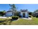 Charming home featuring a well-manicured front yard and attached garage at 2113 E Del Webb Blvd, Sun City Center, FL 33573
