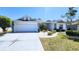 Beautiful single-Gathering home featuring a well-kept lawn and a two-car garage at 2113 E Del Webb Blvd, Sun City Center, FL 33573