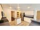Well-lit kitchen featuring white cabinets, modern appliances, and an island with countertop at 2113 E Del Webb Blvd, Sun City Center, FL 33573