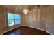 Living room with wood floors, bright window, and elegant chandelier at 2113 E Del Webb Blvd, Sun City Center, FL 33573