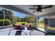 Outdoor living area with comfortable seating and screened in views of the backyard at 2113 E Del Webb Blvd, Sun City Center, FL 33573