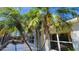 Relaxing screened-in pool and lanai area with lush palm trees at 2113 E Del Webb Blvd, Sun City Center, FL 33573