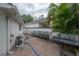 Back patio featuring a brick floor, outdoor grill, and seating area for relaxation and entertainment at 2305 S Hesperides St, Tampa, FL 33629