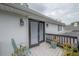 Balcony featuring black railings and outdoor seating with flowers at 2305 S Hesperides St, Tampa, FL 33629