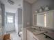 Bathroom with a modern sink, toilet, and shower at 2305 S Hesperides St, Tampa, FL 33629