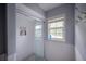 Tiled shower with glass door and built-in niche at 2305 S Hesperides St, Tampa, FL 33629