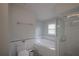 Bright bathroom features a soaking tub and glass-enclosed shower with white subway tile at 2305 S Hesperides St, Tampa, FL 33629