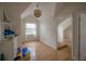 Upstairs bedroom features hardwood floors and a modern light fixture at 2305 S Hesperides St, Tampa, FL 33629