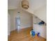 Hallway with beautiful floors, built-in storage, and stylish light fixtures at 2305 S Hesperides St, Tampa, FL 33629