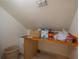 Cozy laundry room with white cabinetry, tiled floors, and wood countertop at 2305 S Hesperides St, Tampa, FL 33629