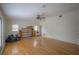 Spacious living room with hardwood floors and lots of light needing renovation to fireplace at 2305 S Hesperides St, Tampa, FL 33629