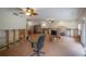 Open living room with brick floors, ceiling fans, and bright lighting at 2305 S Hesperides St, Tampa, FL 33629