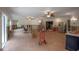 Spacious living room features brick flooring, ceiling fans, and open layout at 2305 S Hesperides St, Tampa, FL 33629