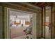 Bright living room featuring brick floors, ceiling fans, and a doorway at 2305 S Hesperides St, Tampa, FL 33629