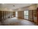 Expansive living space in remodel, featuring multiple windows and exposed wall studs at 2305 S Hesperides St, Tampa, FL 33629