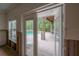 View from inside to the outdoor patio and pool beyond at 2305 S Hesperides St, Tampa, FL 33629