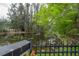 Scenic view of the pond, featuring lush trees and a decorative black iron fence at 2305 S Hesperides St, Tampa, FL 33629