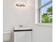 Bathroom featuring a vanity and window at 2401 Havana Dr, Clearwater, FL 33764