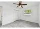 Clean, bright bedroom featuring gray flooring and large window; comfortable and welcoming space at 2401 Havana Dr, Clearwater, FL 33764