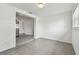 Open-concept dining area features modern tile flooring and an entrance to the kitchen at 2401 Havana Dr, Clearwater, FL 33764