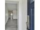 Inviting entryway with a view of the open-concept living space and modern gray floors at 2401 Havana Dr, Clearwater, FL 33764