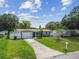 Quaint home with a well-maintained lawn and a cozy curb appeal at 2401 Havana Dr, Clearwater, FL 33764