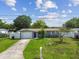 Inviting home with a well-kept front yard, featuring a driveway and a neat exterior at 2401 Havana Dr, Clearwater, FL 33764