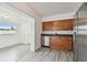 Kitchen with stainless steel appliances and wood cabinets at 2401 Havana Dr, Clearwater, FL 33764