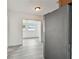 View of an adjacent living space from the kitchen, featuring a stainless steel refrigerator at 2401 Havana Dr, Clearwater, FL 33764