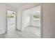 Bright living space featuring a view of the Gathering room and lovely gray tile flooring at 2401 Havana Dr, Clearwater, FL 33764