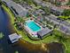 Aerial view of community pool, lake, and landscaping at 273 Countryside Key Blvd, Oldsmar, FL 34677