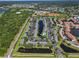 Aerial view of the community's landscaping, swimming pool, and parking at 273 Countryside Key Blvd, Oldsmar, FL 34677