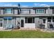 Home exterior boasts a cozy back patio, green grass, and air conditioning unit at 273 Countryside Key Blvd, Oldsmar, FL 34677