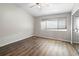 Bedroom with wood-look flooring, ceiling fan, and closet with mirrored doors at 273 Countryside Key Blvd, Oldsmar, FL 34677