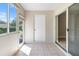 Sunroom has tile flooring and sliding glass door with backyard views at 273 Countryside Key Blvd, Oldsmar, FL 34677
