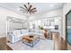 Bright, open-concept living area features hardwood floors and views into kitchen at 2819 Cordoba Ranch Blvd, Lutz, FL 33559