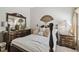 Inviting bedroom featuring a decorative fan and wooden furniture at 3148 Sago Point Ct, Land O Lakes, FL 34639