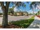 The community entrance features a guard house and lush landscaping with palm trees, enhancing its welcoming ambiance at 3148 Sago Point Ct, Land O Lakes, FL 34639