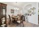 Charming dining room with chandelier, stylish wood table, and detailed décor at 3148 Sago Point Ct, Land O Lakes, FL 34639