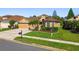 Well-maintained single-story home with a two-car garage and beautiful landscaping at 3148 Sago Point Ct, Land O Lakes, FL 34639