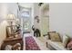 Inviting foyer with tile flooring, decorative accents, and an arched window above the front door at 3148 Sago Point Ct, Land O Lakes, FL 34639