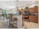 Well-equipped kitchen featuring stainless steel appliances, breakfast bar, and ample cabinet space at 3148 Sago Point Ct, Land O Lakes, FL 34639