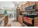 Bright eat-in kitchen features stainless steel appliances and granite countertops at 3148 Sago Point Ct, Land O Lakes, FL 34639