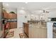 Open kitchen with granite countertops, stainless steel appliances, and wood cabinets at 3148 Sago Point Ct, Land O Lakes, FL 34639